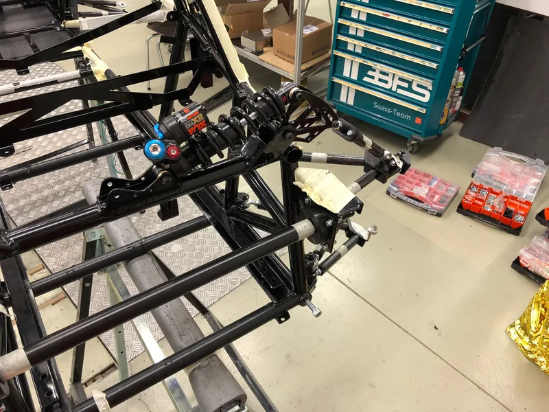 Adia chassis with suspension parts being fitted