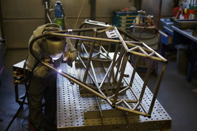 Adia chassis being welded on a fixture table