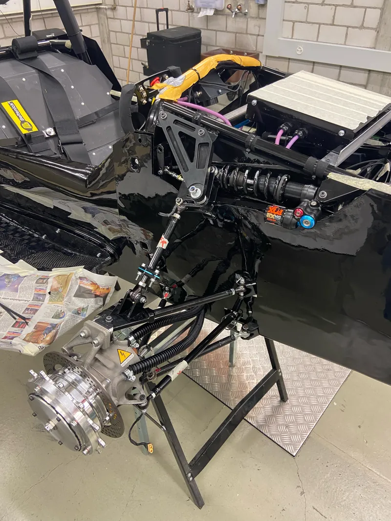 Rear suspension and upright assembled on the car